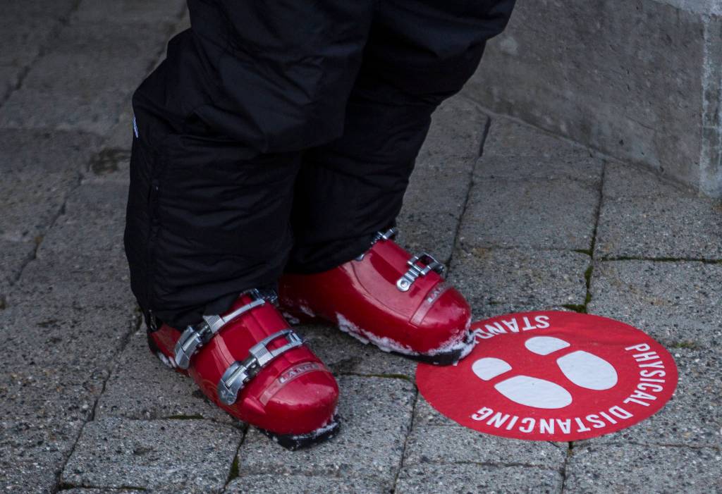 Floor stickers encourage social distancing at Stevens Pass. (Olivia Vanni / The Herald)