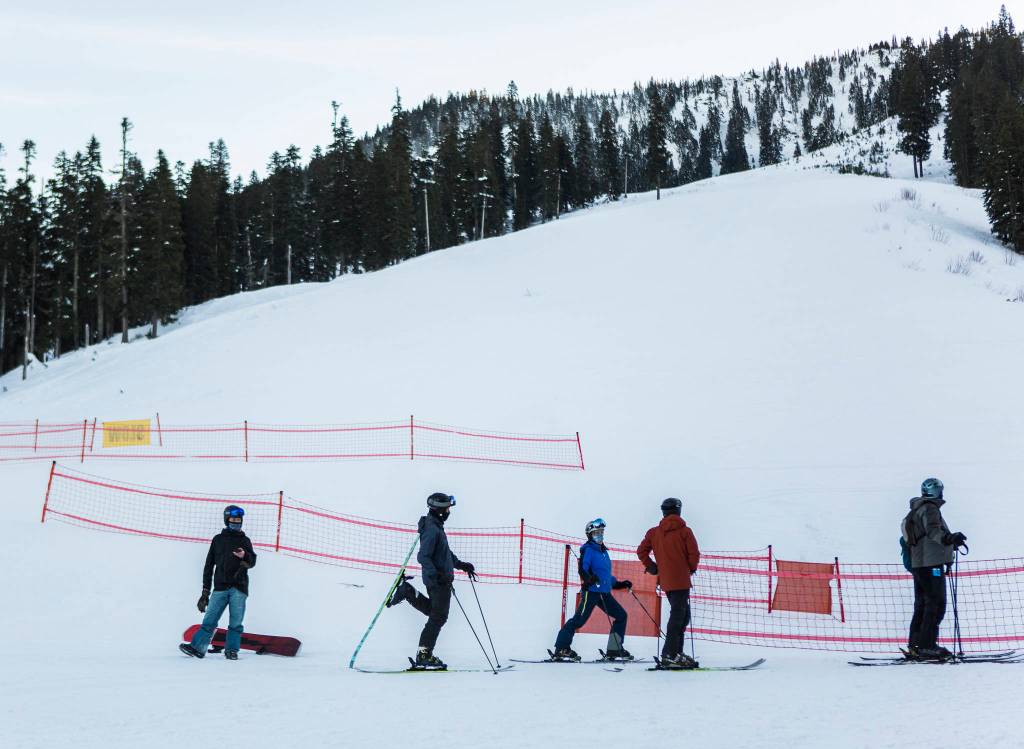 People wait in line for lifts to open at Stevens Pass last Friday. (Olivia Vanni / The Herald)