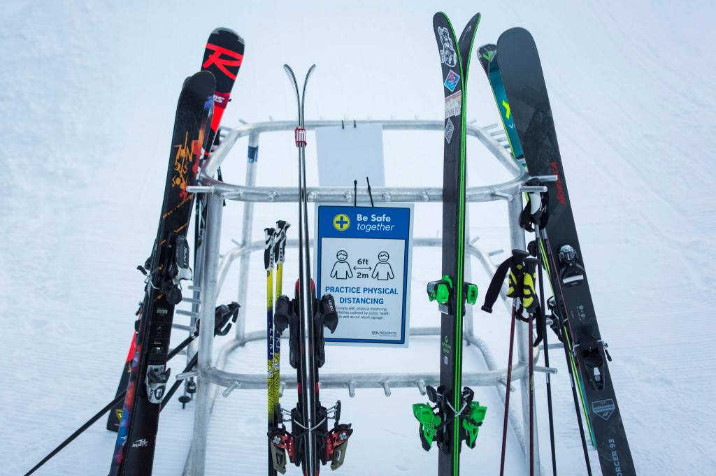 Signs remind people to stay six feet apart at Stevens Pass. (Olivia Vanni / The Herald)