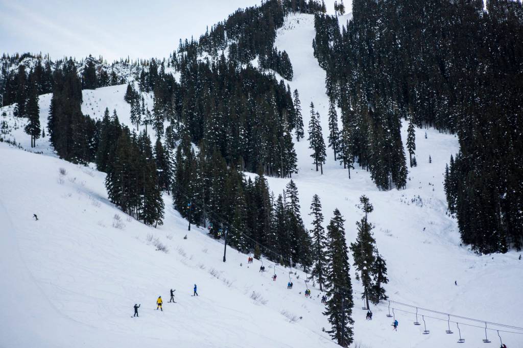 People make their way up and down the mountain at Stevens Pass last Friday. (Olivia Vanni / The Herald)