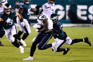 Seattle Seahawks' DK Metcalf, left, is tackled by Philadelphia Eagles' Darius Slay during the first half of an NFL football game, Monday, Nov. 30, 2020, in Philadelphia. (AP Photo/Derik Hamilton)