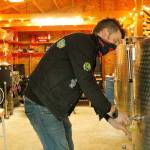 Christopher CJ Powell pours a glass of fresh-hop cider in the production room of his Misfit Island Cider Co. near Langley. Powell said he hopes to open a tasting room this winter. (Kira Erickson / South Whidbey Record).