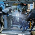 In this July 25 photo, police pepper spray protesters near Seattle Central College during a march and protest in support of Black Lives Matter. (AP Photo/Ted S. Warren, File)