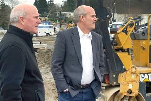 CT CEO Emmett Heath (left) and U.S. Rep. Rick Larsen, D-Washington, tour the Seaway Transit Center across from the main employee parking lot at the Boeing Co.'s Everett plant. The facility is set to open next year as part of the new Swift Green Line to Canyon Park in Bothell. (Noah Haglund / The Herald)