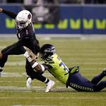 Seattle Seahawks strong safety Jamal Adams, right, gets to Arizona Cardinals quarterback Kyler Murray (1) just as Murray gets a pass off, during the second half of an NFL football game, Thursday, Nov. 19, 2020, in Seattle. (AP Photo/Elaine Thompson)