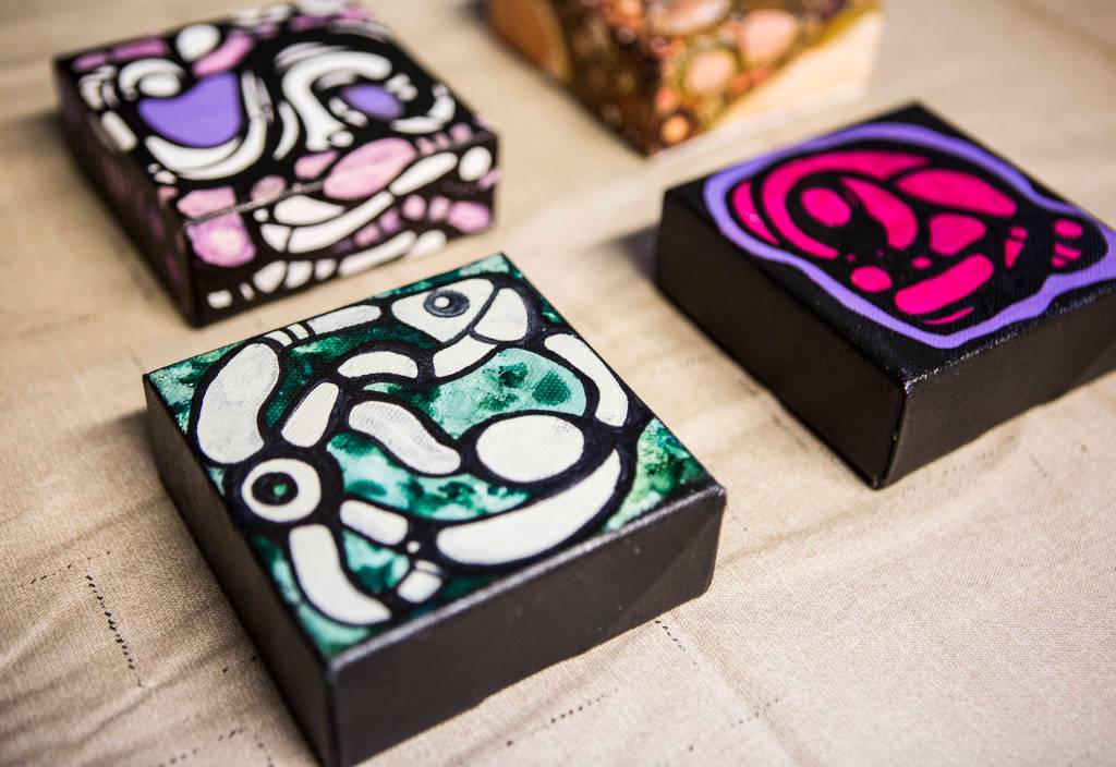 Lu Hernandez created these four small mixed-media pieces with acrylic and alcohol ink. (Olivia Vanni / The Herald)