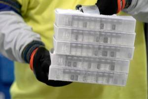 Boxes containing the Pfizer-BioNTech COVID-19 vaccine are prepared to be shipped at the Pfizer Global Supply Kalamazoo manufacturing plant in Portage, Mich., Sunday, Dec. 13, 2020. (AP Photo/Morry Gash, Pool)