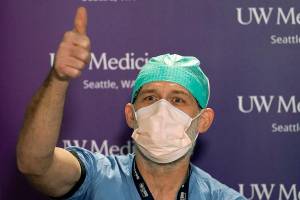Joseph B. Gipson, an environmental services worker at UW Medical Center, gives a thumbs-up when asked if he's ready to receive a COVID-19 vaccination at UW Medicine Tuesday, Dec. 15, 2020, in Seattle. (AP Photo/Elaine Thompson)