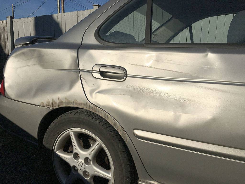 After being sideswiped in Snohomish, Street Smarts transportation columnist Ben Watanabe had his 19-year-old car totaled out by the other drivers insurance company. Its prompted him to evaluate the expense of driving a personal vehicle. (Ben Watanabe / The Herald)