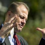 Initiative promoter Tim Eyman gestures as he talks to reporters, Thursday, Oct. 15, 2020, in front of the Temple of Justice at the Capitol in Olympia, Wash. The Washington Supreme Court on Thursday unanimously struck down Eyman's Initiative 976, a measure that would have steeply discounted the price of car registrations at $30 while gutting transportation budgets across Washington state. (AP Photo/Ted S. Warren)