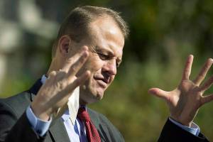 Initiative promoter Tim Eyman gestures as he talks to reporters, Thursday, Oct. 15, 2020, in front of the Temple of Justice at the Capitol in Olympia, Wash. The Washington Supreme Court on Thursday unanimously struck down Eyman's Initiative 976, a measure that would have steeply discounted the price of car registrations at $30 while gutting transportation budgets across Washington state. (AP Photo/Ted S. Warren)