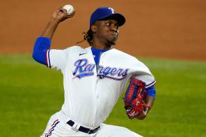 File-This Sept. 9, 2020, file photo shows Texas Rangers relief pitcher Rafael Montero throwing to the Los Angeles Angels in a baseball game in Arlington, Texas. The Seattle Mariners bolstered their bullpen on Tuesday by acquiring right-handed reliever Montero from the Rangers.  (AP Photo/Tony Gutierrez, File)