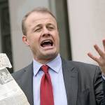 Initiative promoter Tim Eyman talks to reporters, Thursday, Oct. 15, 2020, in front of the Temple of Justice at the Capitol in Olympia, Wash. The Washington Supreme Court on Thursday unanimously struck down Eyman's Initiative 976, a measure that would have steeply discounted the price of car registrations at $30 while gutting transportation budgets across Washington state. (AP Photo/Ted S. Warren)