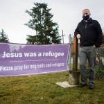Pastor Tim Olseon, outside Edmonds Lutheran Church, where he has set up a Nativity surrounded by chain-link fence to shine a light on immigration issues. (Olivia Vanni / The Herald)