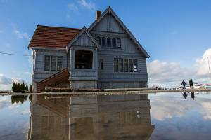 People walk by the Weyerhaeuser Building at Boxcar Park on Tuesday, Dec. 22, 2020 in Everett, Wa. (Olivia Vanni / The Herald)