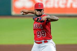 Los Angeles Angels relief pitcher Keynan Middleton (99) throws against the Houston Astros during a baseball game Monday, Aug. 24, 2020, in Houston. (AP Photo/Michael Wyke)