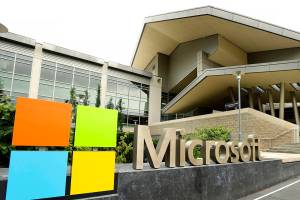 FILE - This July 3, 2014 file photo shows Microsoft Corp. signage outside the Microsoft Visitor Center in Redmond, Wash. The volume of option contracts to buy or sell Microsoft and Tesla shares is up more than twofold from 2019, while Apple option contract volume is up more than 86%. (AP Photo/Ted S. Warren, File)