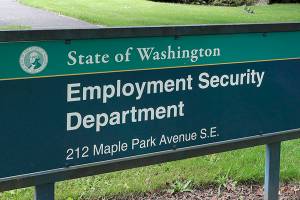This photo shows a sign at the headquarters for Washington state's Employment Security Department Tuesday, May 26, 2020, at the Capitol in Olympia, Wash. Washington state's rush to get unemployment benefits to residents who lost jobs due to the coronavirus outbreak left it vulnerable to criminals who made off with hundreds of millions of dollars in fraudulent claims. (AP Photo/Ted S. Warren)