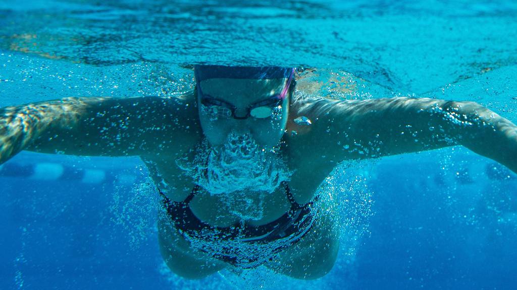 Jackson High School graduate Nicole Limberg competes in an event for the Rice University swim team. (Photo courtesy Rice University)