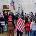 CORRECTS SPELLING TO SELSKY NOT SELSKI Pro-Trump and anti-mask demonstrators hold a rally outside the Oregon State Capitol on Monday, Dec. 21, 2020, as legislators meet for an emergency session. (AP Photo/Andrew Selsky)