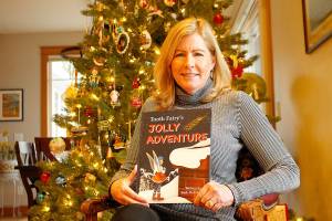 Langley author Barb DeMartino’s Christmas-themed children’s book was recently published, just in time for the holidays. “Tooth Fairy’s Jolly Adventure” was inspired by DeMartino’s six-year-old grandson, who lost a tooth on Christmas Eve last year. Photo by Kira Erickson/South Whidbey Record
