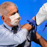 Dr. Anthony Fauci, director of the National Institute of Allergy and Infectious Diseases, prepares to receive his first dose of the COVID-19 vaccine at the National Institutes of Health, Tuesday, Dec. 22, 2020, in Bethesda, Md. (AP Photo/Patrick Semansky, Pool)