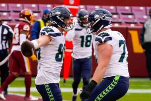 Seattle Seahawks tight end Jacob Hollister (86) celebrating his touchdown with teammate Seattle Seahawks center Ethan Pocic (77) during the first half of an NFL football game against the Washington Football Team, Sunday, Dec. 20, 2020, in Landover, Md. (AP Photo/Andrew Harnik)