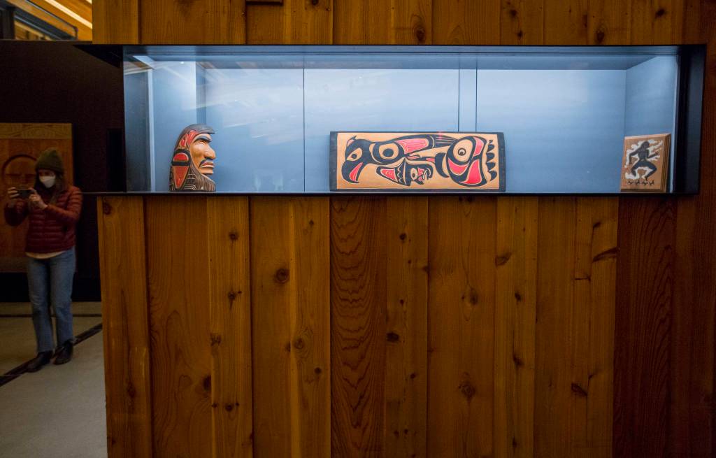 People pause to take pictures inside the new Mukilteo ferry terminal on Tuesday. (Olivia Vanni / The Herald)