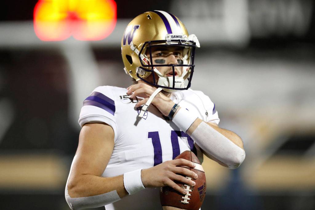 Washington quarterback Jacob Eason warms up before a game against Colorado on Nov. 23, 2019, in Boulder, Colo. (AP Photo/David Zalubowski)