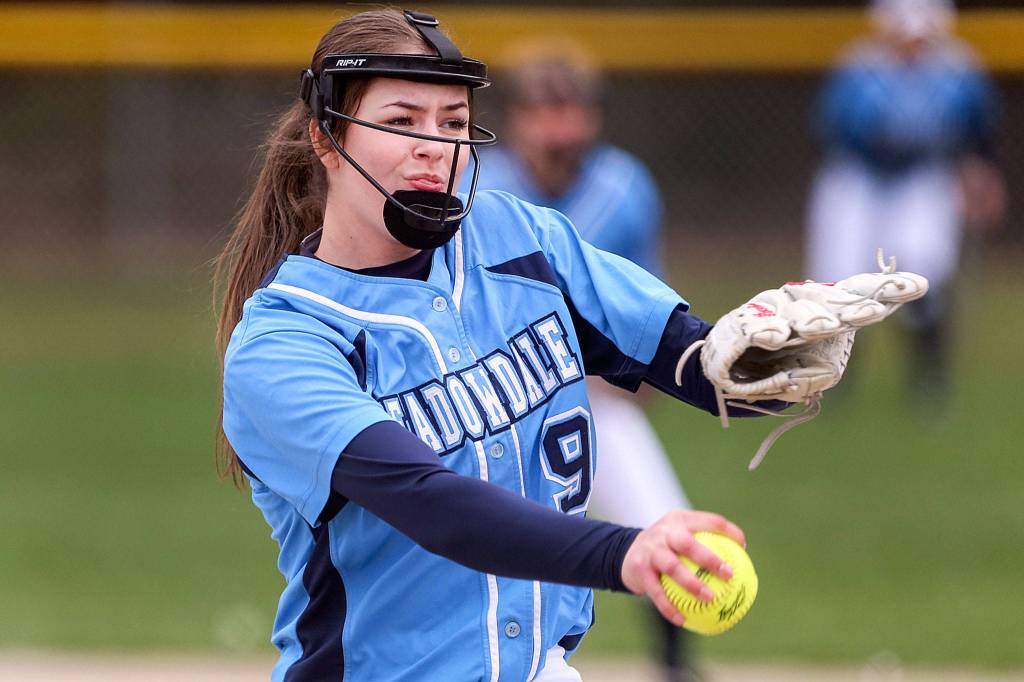 Meadowdales Kate Houghton throws a pitch during a game against Marysville Pilchuck in 2019 at Meadowdale High School in Lynnwood. (Kevin Clark / The Herald)