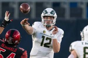 Colorado State quarterback Patrick O'Brien (12), center, passes to tight end Trey McBride (85), right, over San Diego State linebacker Caden McDonald (54) during an NCAA football game on Saturday, Dec. 5, 2020 in Carson, Calif. (AP Photo/Kyusung Gong)