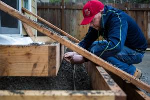 Adam Ling works securing rebar reinforcement for a set of stairs on Tuesday, Jan. 5, 2020 in Lynnwood, Wa. (Olivia Vanni / The Herald)