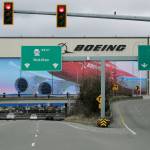 Cars drive near Boeings manufacturing facility in Everett on March 23 north of Seattle. (AP Photo/Ted S. Warren)