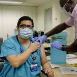 Dr. George Diaz is vaccinated at Providence Regional Medical Center Everett on Dec. 18. (Providence)
