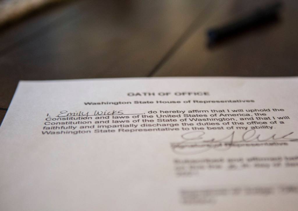 State Rep. Emily Wicks signed her oath of office. She will bring it with her to Olympia on Monday. (Olivia Vanni / The Herald)