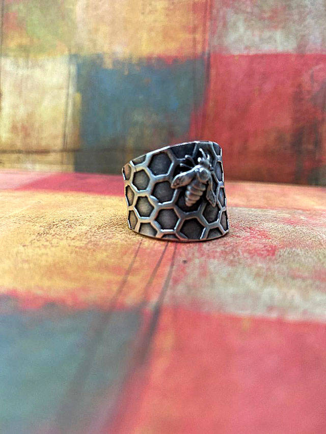 This sterling silver honeycomb and bee ring is from Krystal Mundays Honeycomb Collection.