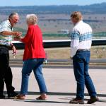 In this 2018 photo, rancher Dwight Hammond Jr. (left) is embraced by his wife, Susie Hammond, after arriving by private jet at the Burns Municipal Airport in Burns, Oregon. Hammond and his son Steven, convicted of intentionally setting fires on public land in Oregon, were pardoned by President Donald Trump. The federal government has proposed awarding grazing allotments to the Hammonds, whose case sparked the takeover of a federal wildlife refuge by right-wing extremists in 2016. (Beth Nakamura/The Oregonian via AP, File)