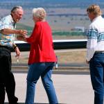 FILE - In this July 11, 2018, file photo, rancher Dwight Hammond Jr., left, is embraced by his wife, Susie Hammond, after arriving by private jet at the Burns Municipal Airport in Burns, Ore. Hammond and his son Steven, convicted of intentionally setting fires on public land in Oregon, were pardoned by President Donald Trump. The federal government has proposed awarding grazing allotments to the Hammonds, whose case sparked the takeover of a federal wildlife refuge by right-wing extremists in 2016. (Beth Nakamura/The Oregonian via AP, File)