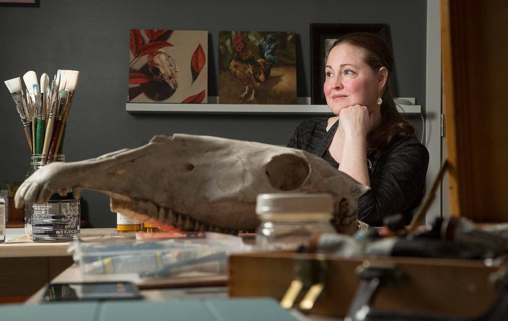 Artist Nikki Gardner, who mostly works in oil paints, in her Snohomish studio on Wednesday. (Andy Bronson / The Herald)