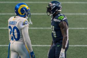 Los Angeles Rams defensive back Jalen Ramsey (20) and Seattle Seahawks wide receiver DK Metcalf talk between plays during the second half of an NFL football game, Sunday, Dec. 27, 2020, in Seattle. The Seahawks won 20-9. (AP Photo/Stephen Brashear)
