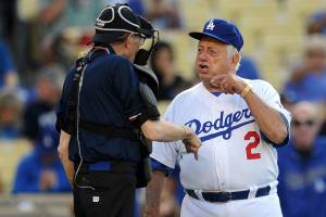 Hall of Fame and former Los Angeles Dodgers manager Tommy Lasorda passed away at the age of 93. Former Los Angeles Dodgers manger Tommy Lasorda argues with home plate umpire Larry King during the Old-Timers game prior to a baseball game between the Atlanta Braves and the Los Angeles Dodgers on Saturday, June 8, 2013 in Los Angeles. (Keith Birmingham/The Orange County Register via AP)
