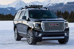 GMC Yukon Denali’s trademark chrome grille is bigger and more detailed on the all-new 2021 model. (Manufacturer photo)