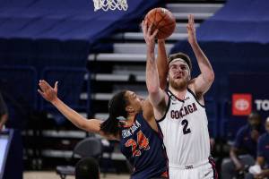 Gonzaga forward Drew Timme (2) shoots while pressured by Pepperdine forward Kene Chukwuka (24) during the first half of an NCAA college basketball game in Spokane, Wash., Thursday, Jan. 14, 2021. (AP Photo/Young Kwak)