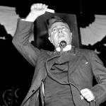 Father Charles E. Coughlin broadcasts in Royal Oak, Michigan, Oct. 26, 1936. (AP Photo)