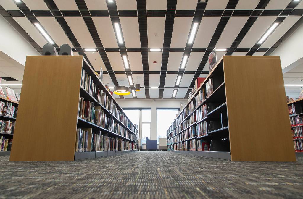 The new library has short, long bookshelves for students and staff to see over them. (Andy Bronson / The Herald)