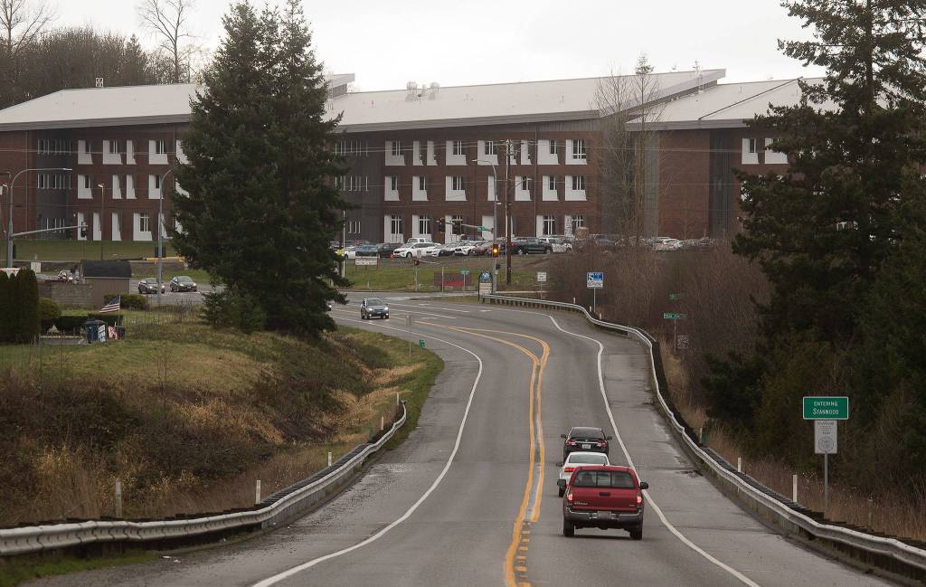 The new three-story Stanwood High School dominates the view of drivers as they enter Stanwood city limits on Monday. The new building, at 260,000-square-feet, replaces the former school built in 1971. (Andy Bronson / The Herald)