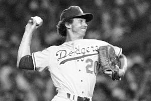 File-This July 20, 1977, file photo shows American League pitcher Don Sutton of the Los Angeles Dodgers in the 48th All-Star Game in New York Sutton, a Hall of Fame pitcher who was a stalwart of the Los Angeles Dodgers' rotation spanning an era from Sandy Koufax to Fernando Valenzuela, died Tuesday, Jan. 19, 2021. He was 75. The Baseball Hall of Fame in Cooperstown, New York, said Sutton died at his home in Rancho Mirage, California, after a long struggle with cancer. The Atlanta Braves, where Sutton was a long-time broadcaster, said he died in his sleep.  (AP Photo, File) (AP Photo, File)