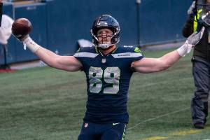 Seattle Seahawks tight end Will Dissly celebrates scroring a touchdown during the second half of an NFL football game, Sunday, Dec. 13, 2020, in Seattle. The Seahawks won 40-3. (AP Photo/Stephen Brashear)