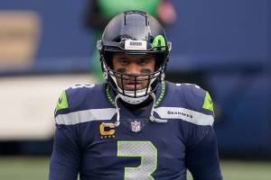 Seattle Seahawks quarterback Russell Wilson (3) walks on the field before an NFL wild-card playoff football game against the Los Angeles Rams, Saturday, Jan. 9, 2021, in Seattle. (AP Photo/Ted S. Warren)