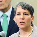 FILE - In this Jan. 24, 2019 file photo Washington Gov. Jay Inslee, left, looks on as Suzi LeVine, right, the state's Employment Security Department Commissioner, talks to reporters at the Capitol in Olympia, Wash. The state of Washington is calling in the National Guard to help process unemployment benefit claims as officials grapple with a backlog caused in part by a fraud ring that stole more than half a billion dollars in aid, officials said Thursday, June 11, 2020. LeVine said that Gov. Jay Inslee approved the deployment of troops who will start assisting her team next week as it tries to reduce the unemployment claim backlog.(AP Photo/Ted S. Warren,File)
